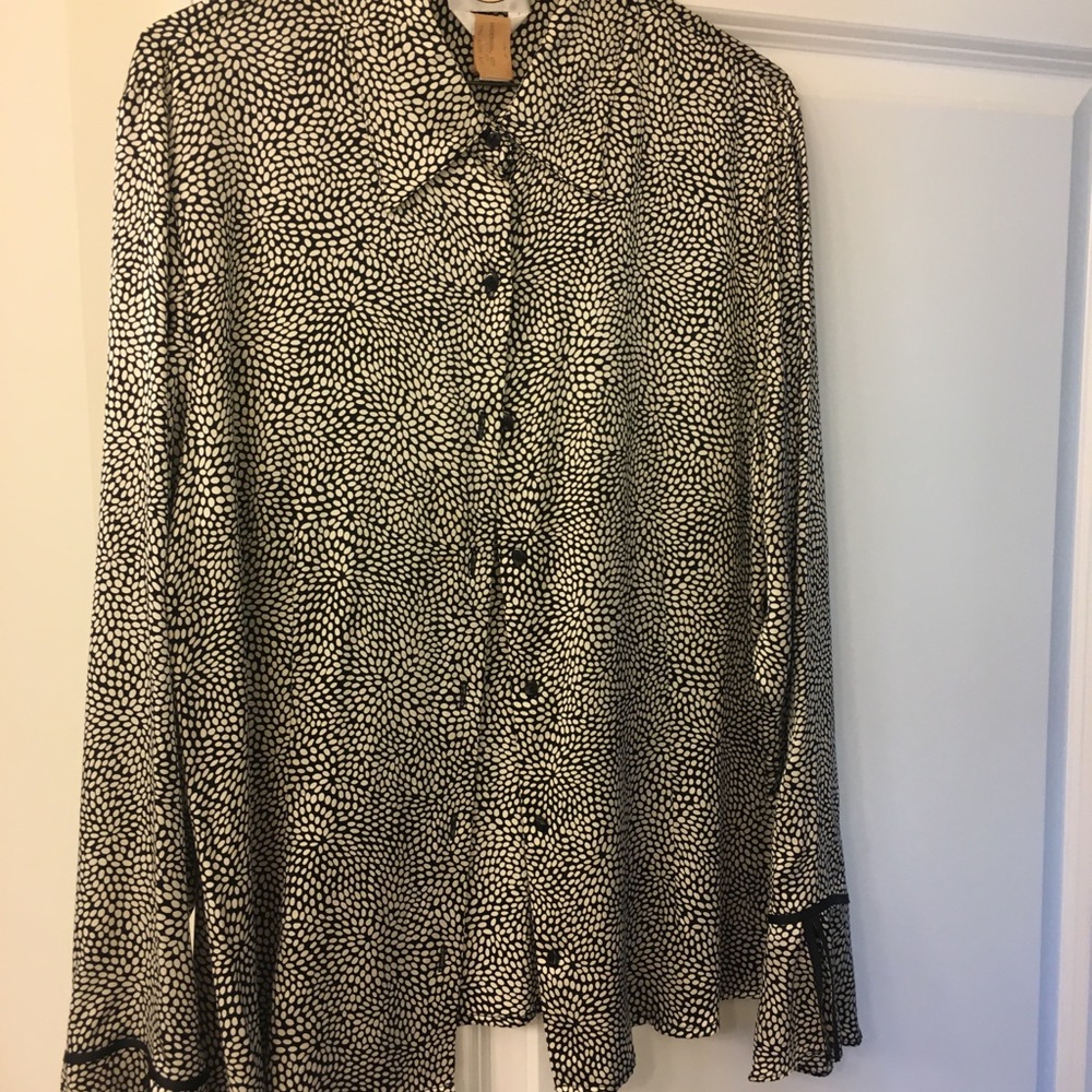 Beautiful silk blouse with bell sleeves.